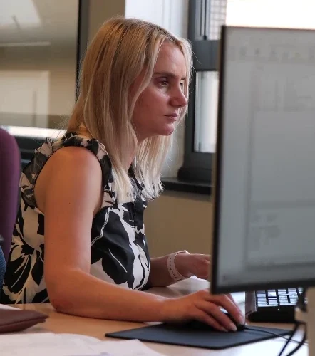 Agnes working at her desk